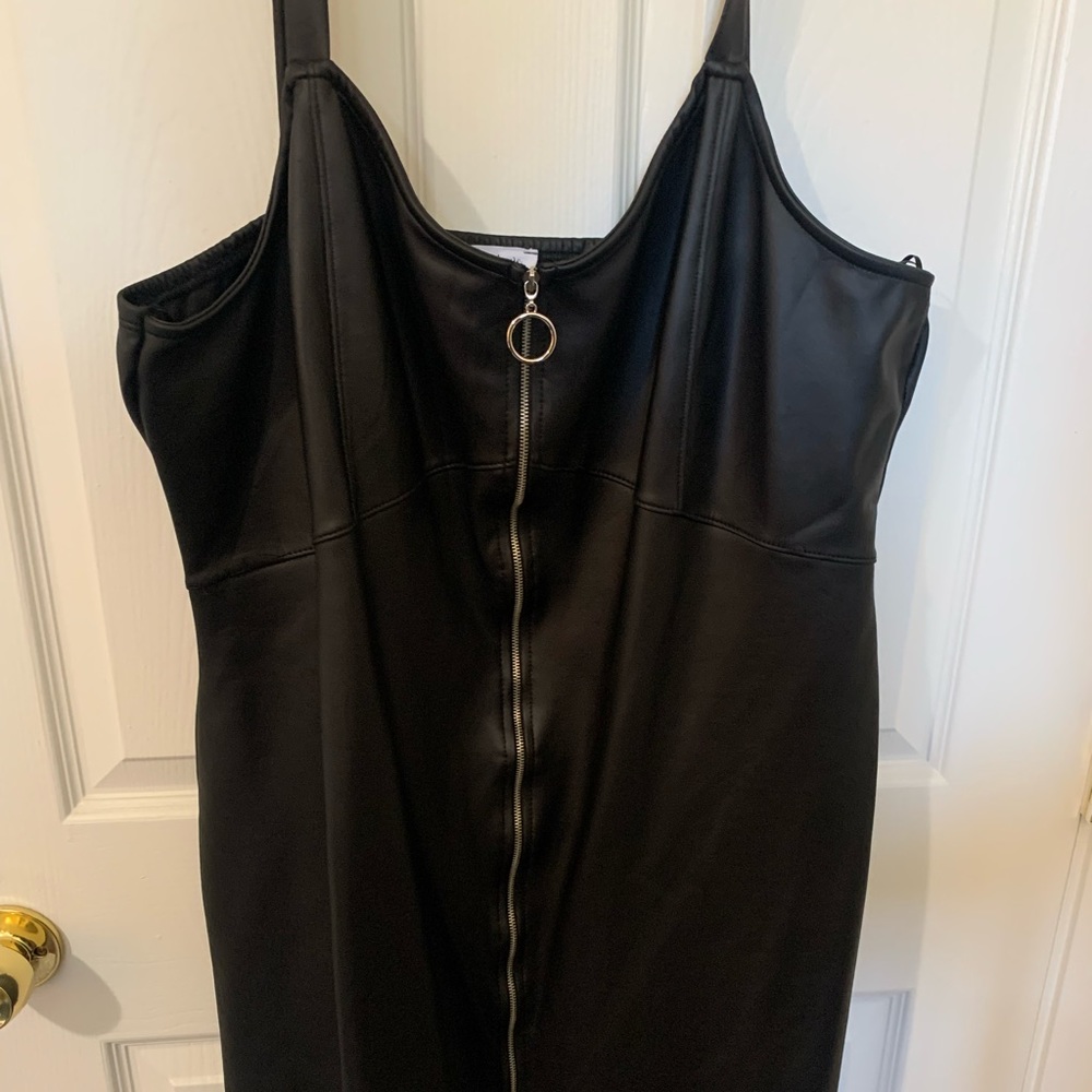 This is a short faux leather zip up dress. This is perfect for a night out!